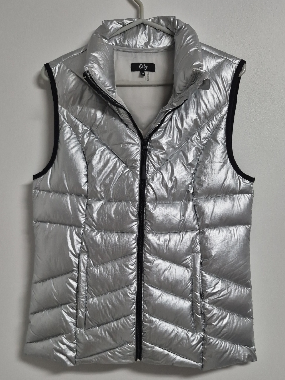 Orly Metallic Silver Quilted Puffer Vest with Stand Collar And Pockets.